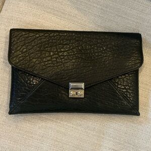 Henri Bendel black leather large size clutch with silk lining